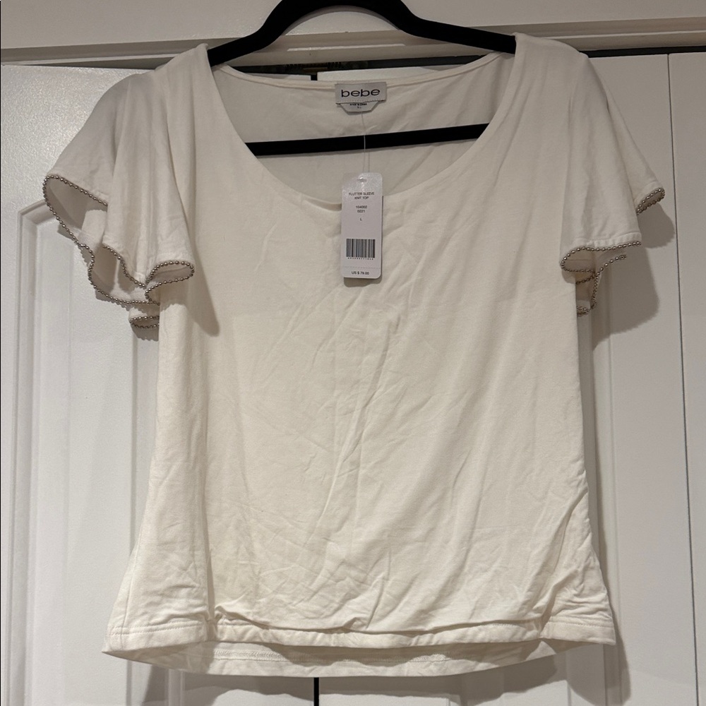 Bebe Ivory flutter sleeve Short Sleeve Top large‎ NWT